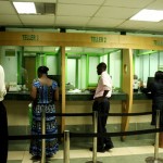 0012-customers-getting-served-over-the-counter-as-afya-centre-fosa-img-two